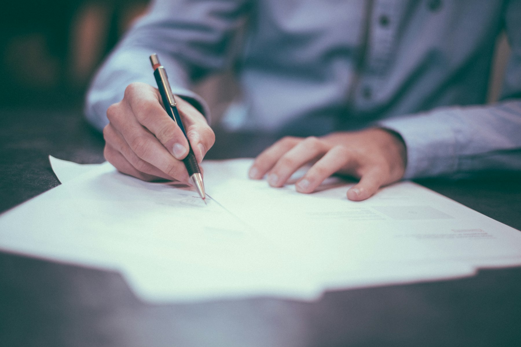 Working through a contract document with a pen
