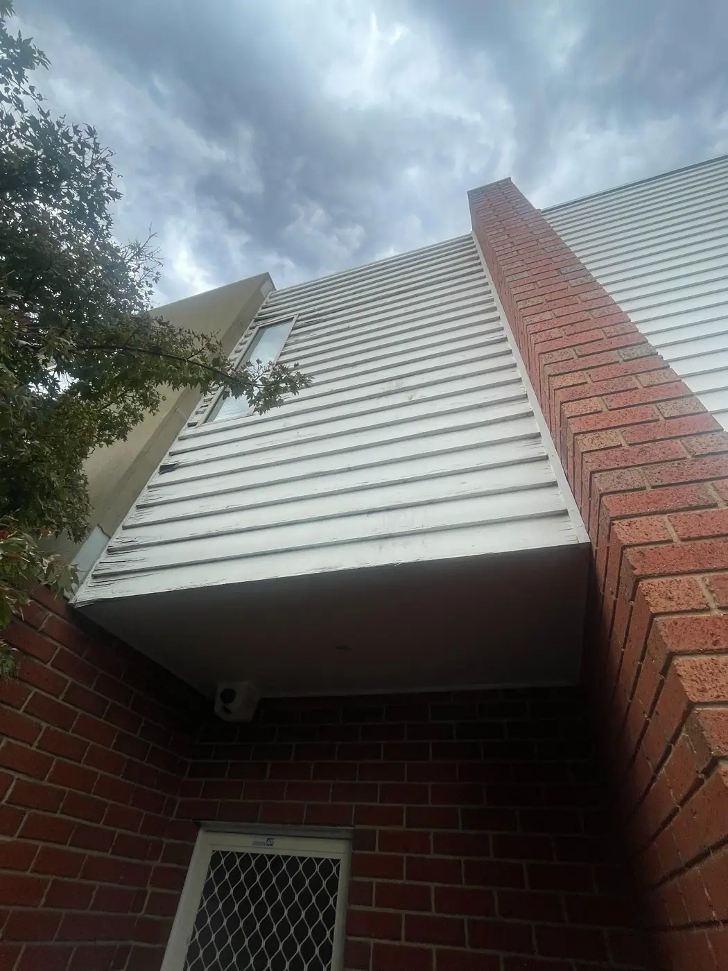 Coburg · Deteriorated timber weatherboards before replacement.