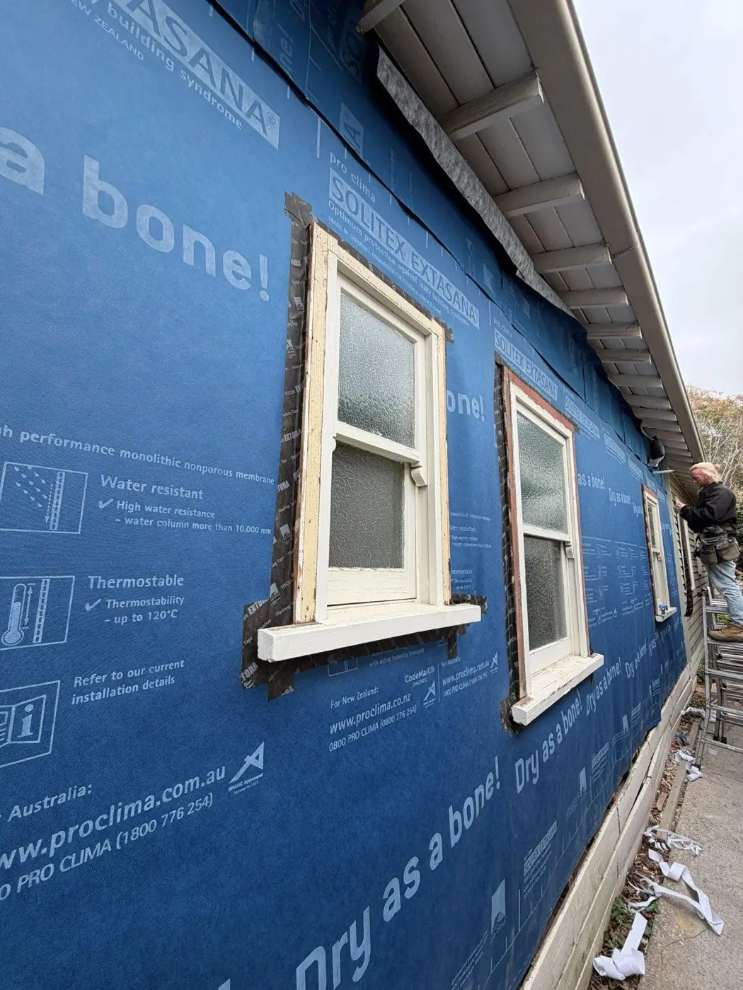 Pro Clima membrane installed and integrated around existing window openings.