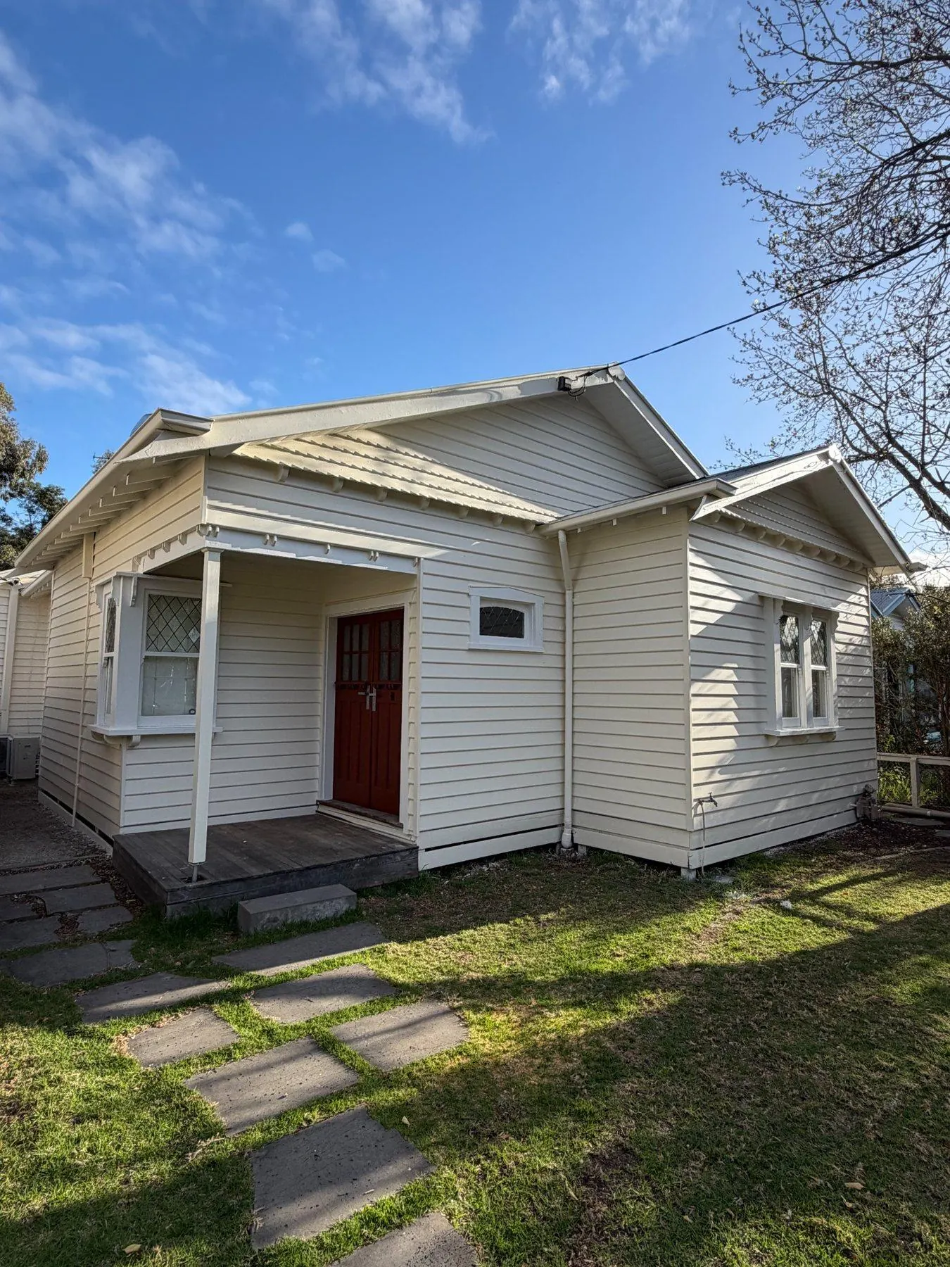 Completed weatherboard replacement on a Northcote home, repainted cream with restored windows