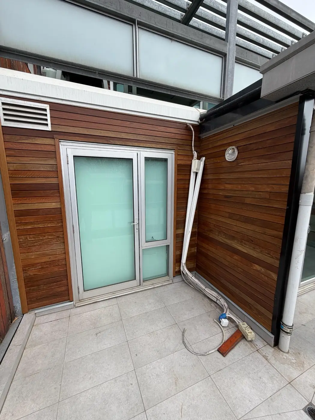 Shiplap cladding installed around an external courtyard.