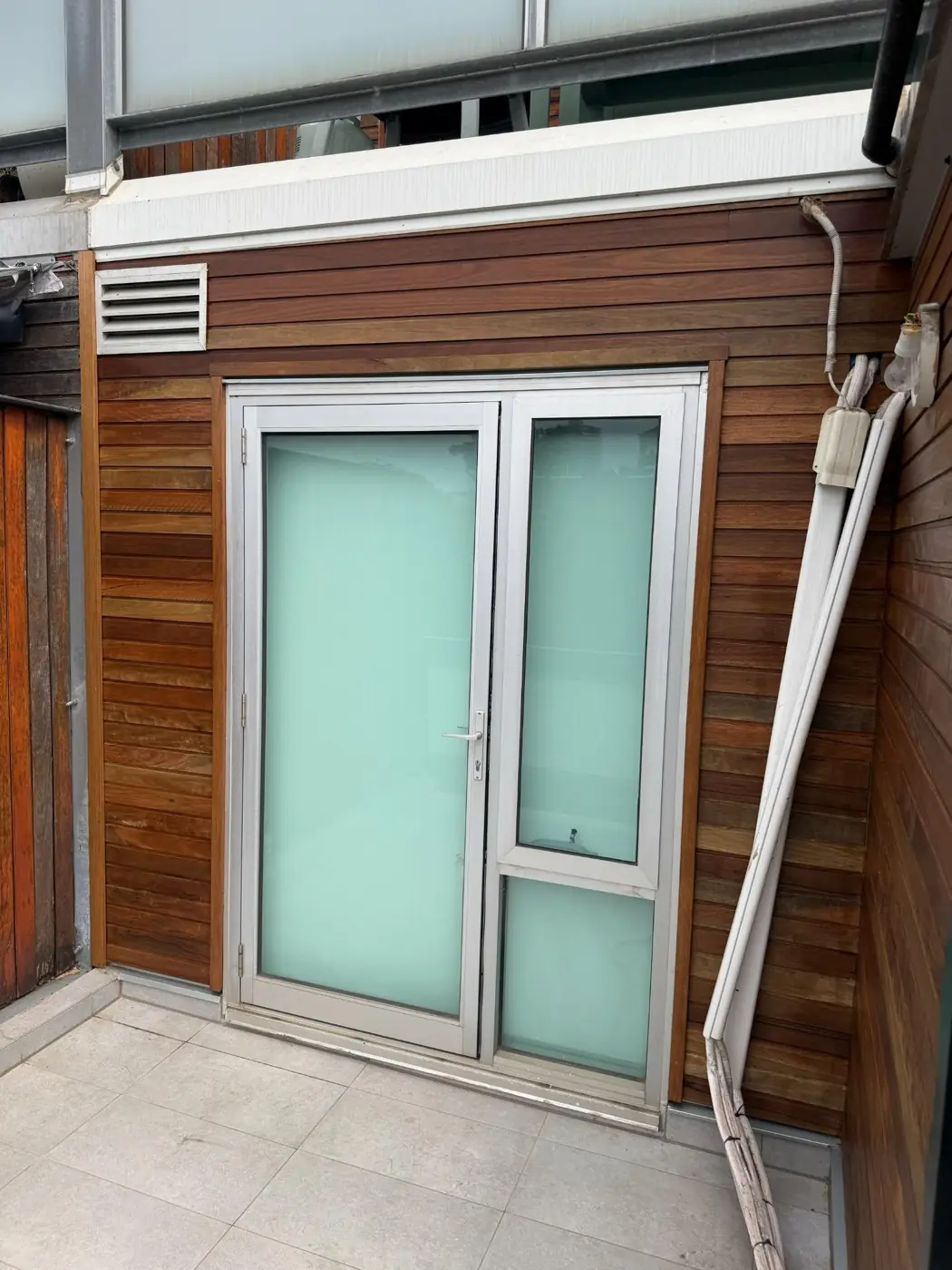 Detailed shiplap installation around openings.