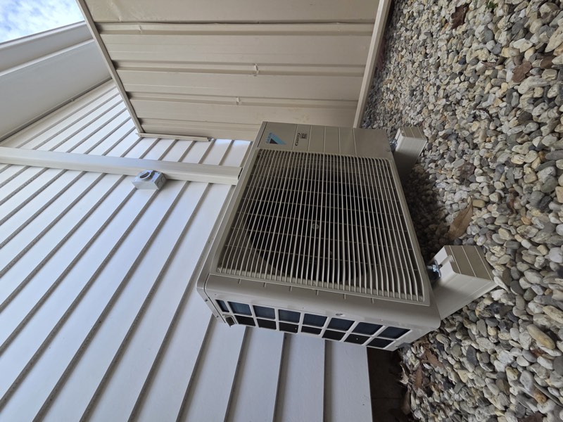 Daikin outdoor unit installed beside a home