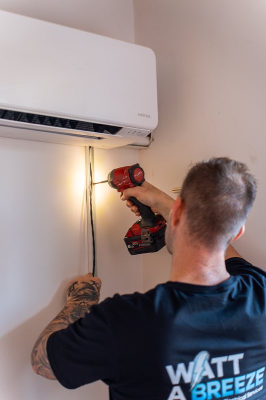 Installing a wall-mounted split system indoors