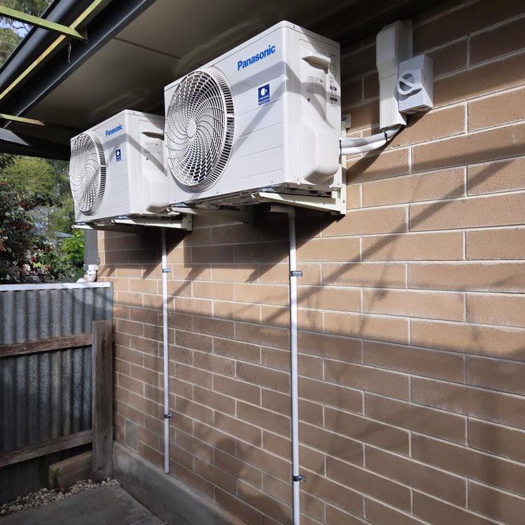 Twin Panasonic outdoor units installed side by side