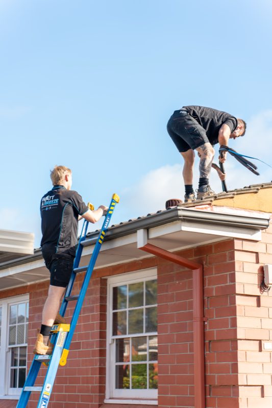Watt A Breeze technicians working on a roof